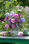 Early summer bouquet of roses, knapweeds, irises, widow's-eye flowers and lady's mantle