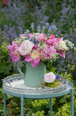 Bouquet of peonies with wild caraway and speedwell
