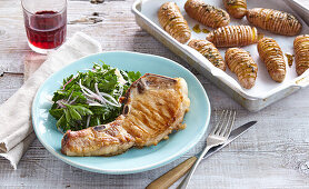 Pork cutlets with parsley salad and baked potatoes