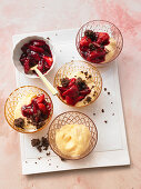 Vanilla pudding with strawberry compote and cocoa-and-almond crumble