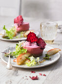 Beetroot mousse with beetroot crispy and a salad garnish