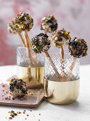Cream cheese 'pops' made from soft sour cherries, pumpernickel and macadamia nuts