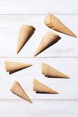 Empty ice cream cones on a white surface