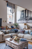 Corner sofa in the living room in maritime nautical style with decorative boat