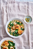 Creamy spinach and parsley root stew with sourdough and feta dumplings