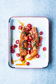 Roast salmon with cherry tomatoes and rosemary
