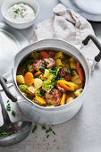 Winter savoy cabbage and carrot stew with meatballs