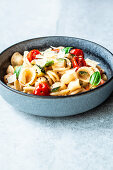 Summer pasta with tomatoes and courgettes