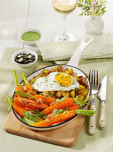 Carrots with fried potatoes and fried egg