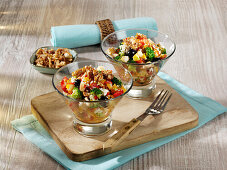 Fruity broccoli couscous salad with blueberries, nuts and feta cheese