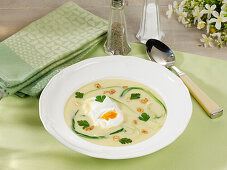 Potato-and-garlic soup with poached eggs