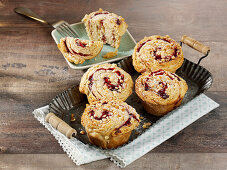Croissant muffins with blackberry jam and almonds