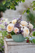 Summer arrangement of roses, catnips, and oregano flowers