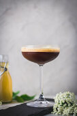Espresso-Shakerato mocktail with elderberry syrup