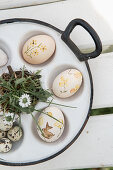 Hand-painted Easter eggs in vintage egg poaching pan