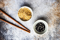 Bowl full of sesame seeds and soy sauce with oil and sesame