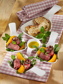 Roast beef rolls with a tuna-and-cream cheese filling