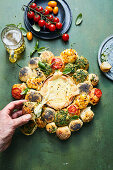 Bread roll wreath with cheese dip