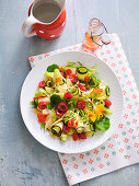 Mixed leaf salad with raw courgette and raspberry vinaigrette