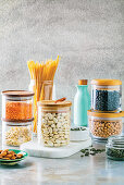 Condiments from the pantry - beans, lentils, pasta, almonds and pumpkin seeds