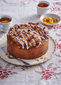 Yeast rolled cake with raisins and icing