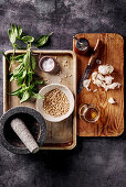 Italian pesto sauce ingredients on vintage background