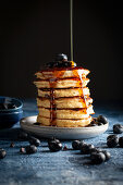 Chocolate Chip Pancakes with Blueberries, Maple Syrup and Powdered Sugar