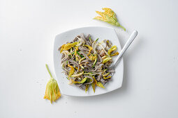 Buckwheat tagliatelle with zucchini and squash flowers