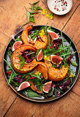 Vegan pumpkin salad with figs and rocket salad