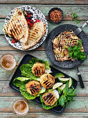 Vegetarian BBQ: grilled veggie patties with salad, grilled tofu with coriander, and grillled tortillia with beans