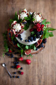 Fig tart with fresh figs, cream and berries
