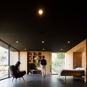 Central room with bedstead and shelving in a Pavilion House