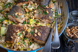 Trout with braised leeks and walnuts