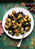 Baked Brussels sprouts with grapes and walnuts