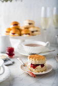 Afternoon tea with scone with cream and jam