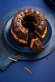 Vegan chocolate Bundt cake filled with pumpkin buttercream and dark nougat glaze
