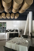 Barrels hanging from the ceiling in the dining room of the Viura Hotel, Rioja, Spain