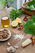 Ingredients for pesto made with nasturtiums and walnuts