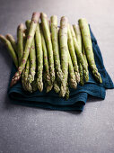Fresh green asparagus spears on a towel