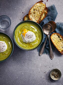 Cream of asparagus soup with poached egg and toasted bread