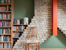 Library and study in the finished live in attic, brick detail of the surviving chimney stack