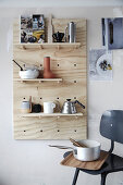 A homemade peg board shelf made of plywood