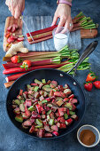 Rhubarb, strawberries, granola and yogurt dessert preparing