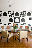 Living room in 60s style with black and white wall decoration
