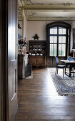 View into dining room with ornate ceilings