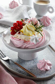 Mini meringue cake with cream, berries and pistachios