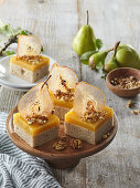 Sweet cake bars with walnuts and pear cream