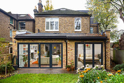 View of brick terrace house seen from garden