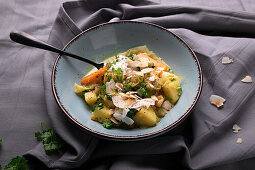 Vegan pointed cabbage and coconut curry with potatoes, carrots and spinach