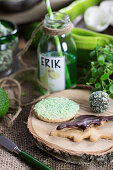 Biscuits, confectionery and a green drink for a dinosaur party